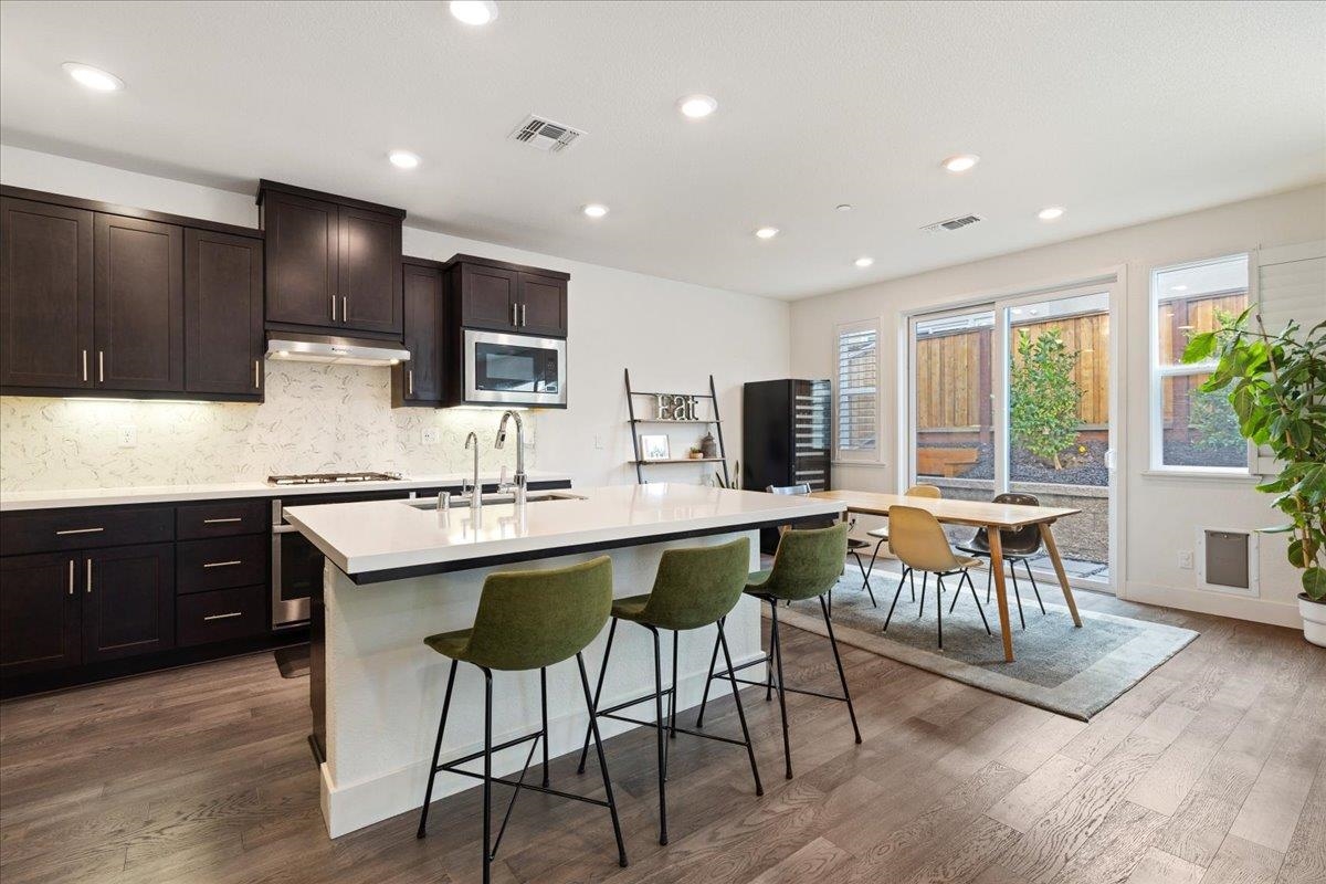 2005 Davoli Court San Ramon, CA 94583 - Photo 9 of 45 Kitchen with island with sink, tasteful backsplash, and recessed lighting
