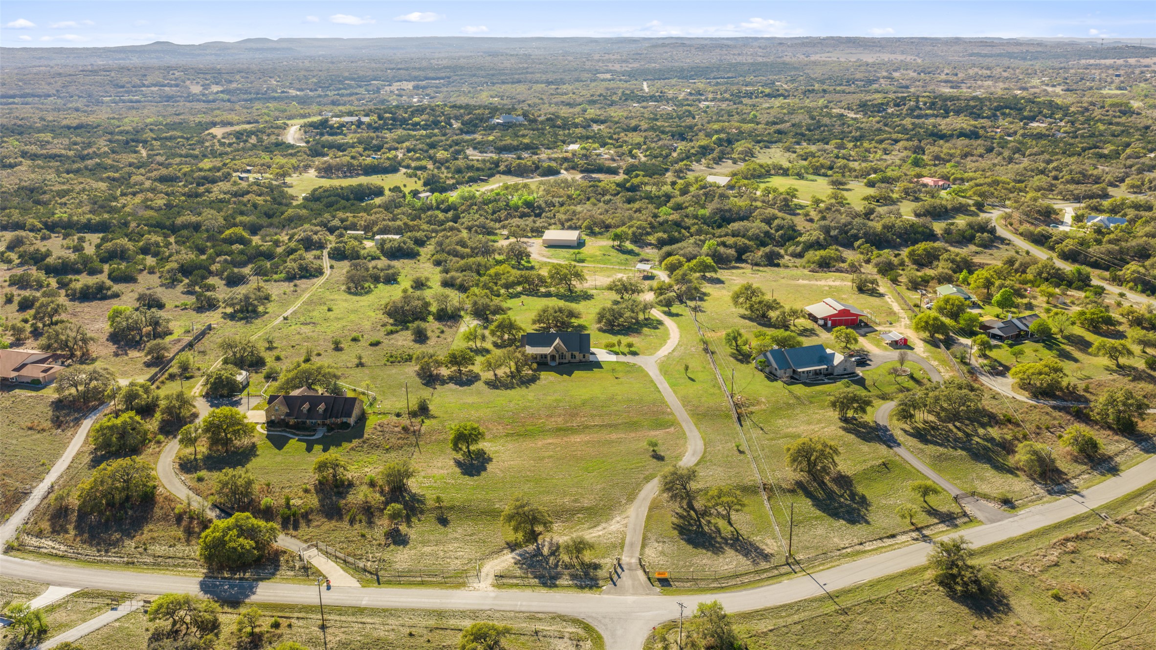 118 Landons Way Blanco, TX 78606 - Photo 13 of 32 an aerial view of residential houses with outdoor space