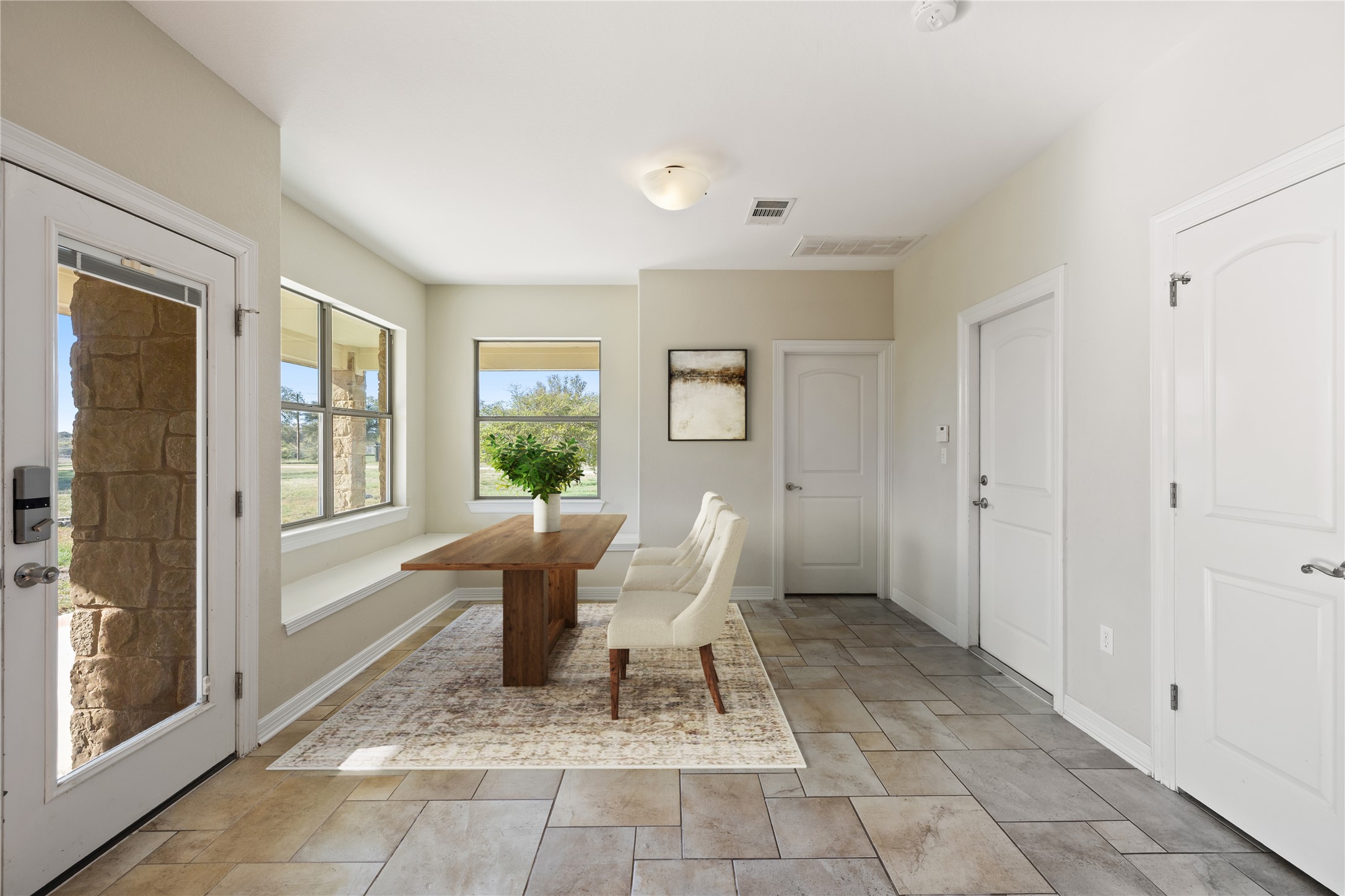 118 Landons Way Blanco, TX 78606 - Photo 16 of 32 a living room with a couch and large windows
