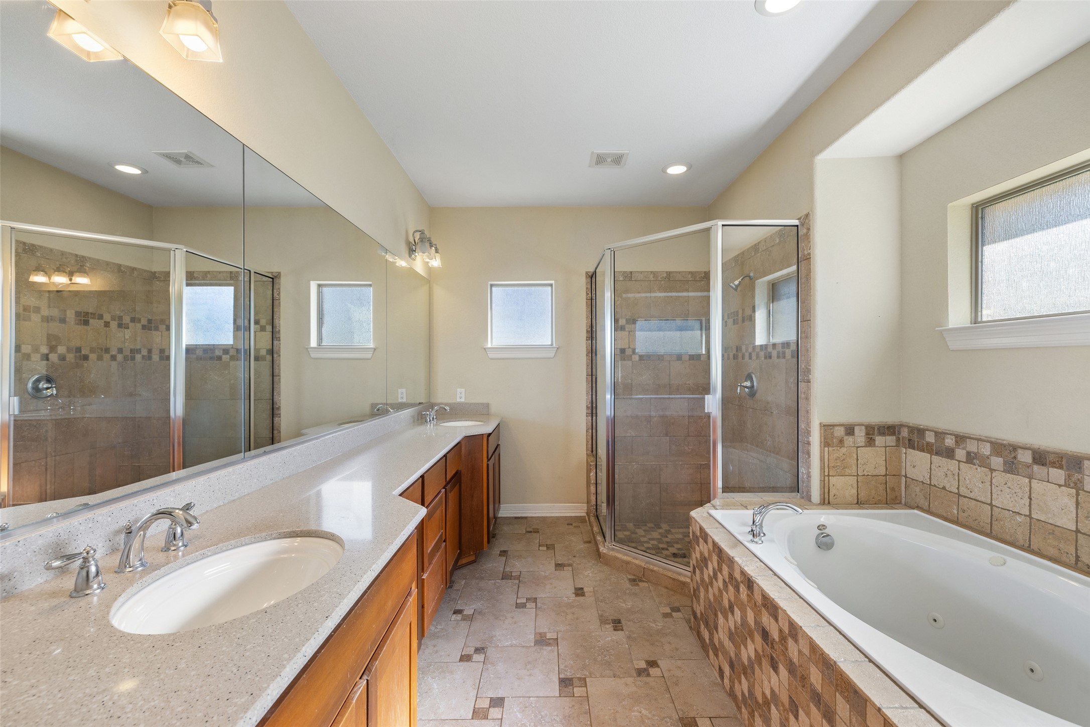 118 Landons Way Blanco, TX 78606 - Photo 21 of 32 a bathroom with a granite countertop tub sink shower and mirror