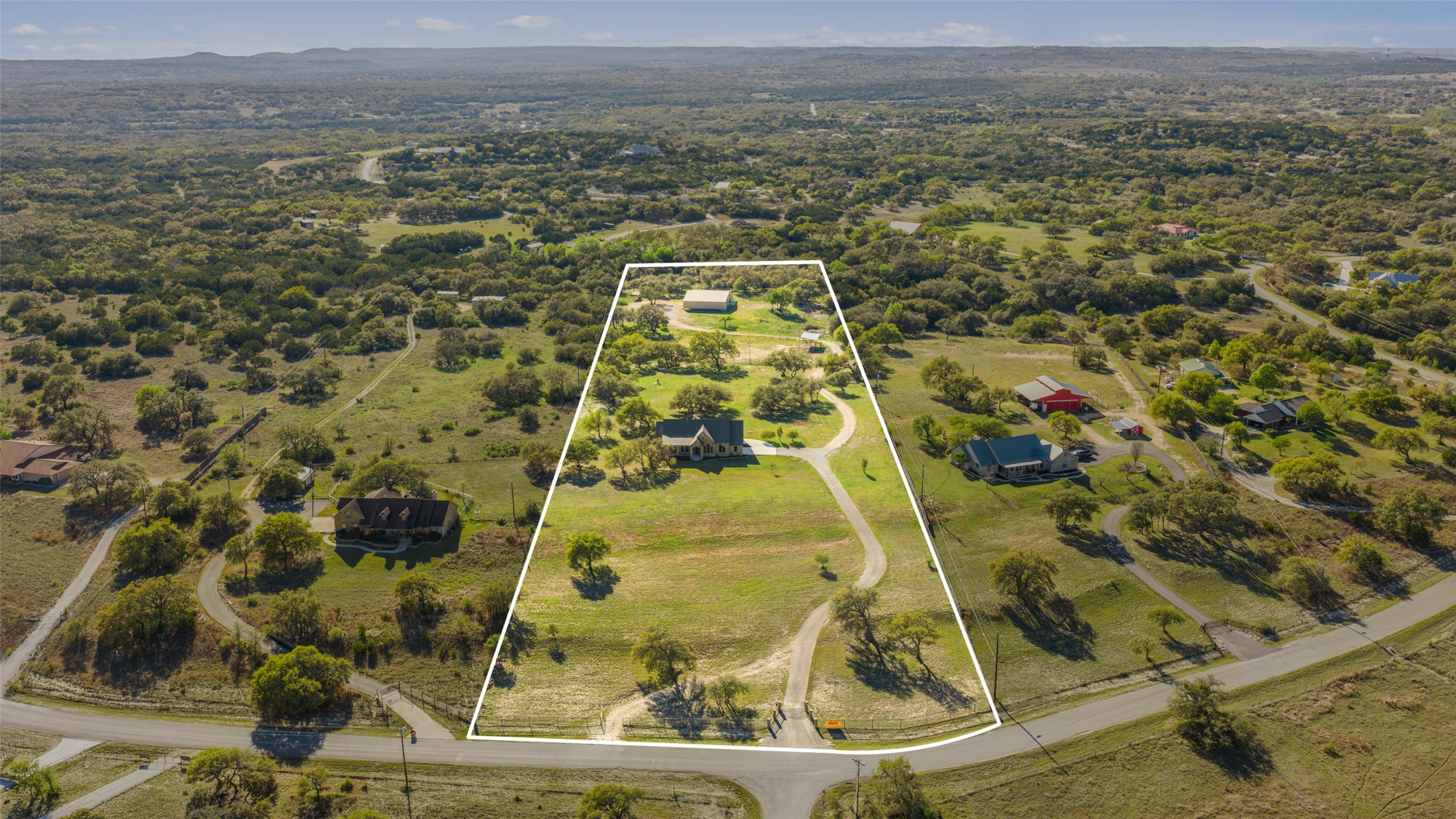 118 Landons Way Blanco, TX 78606 - Photo 7 of 32 an aerial view of residential houses with outdoor space