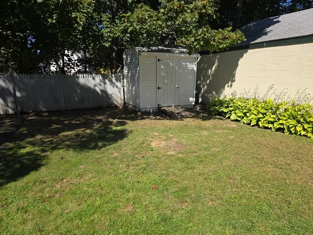 a backyard of a house with lots of green space