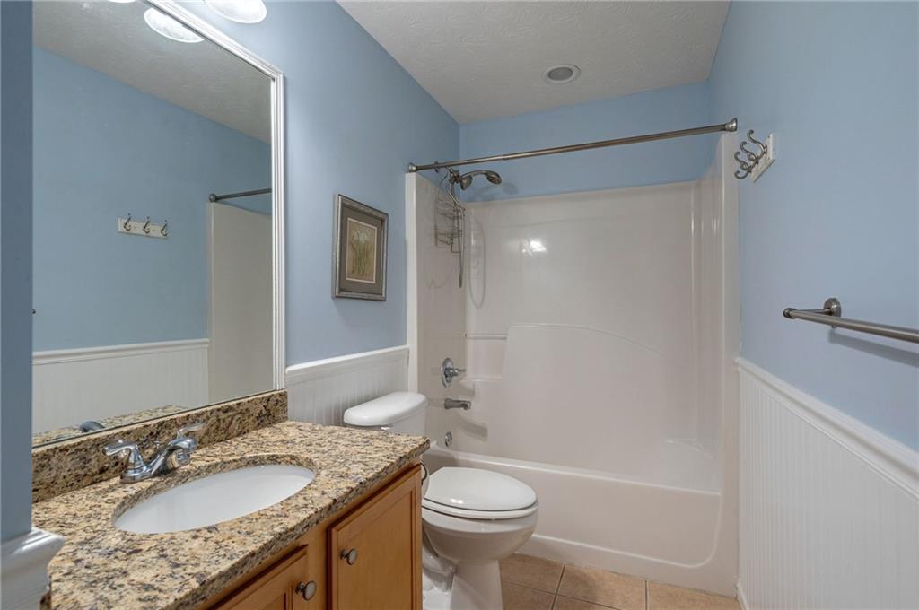 245 Memory Lane Winder, GA 30680 - Photo 34 of 62 a bathroom with a granite countertop sink toilet and shower