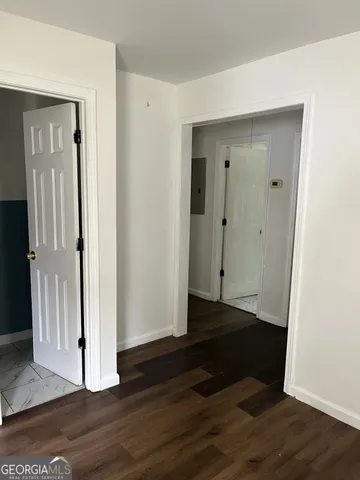 a white toilet sitting next to a shower