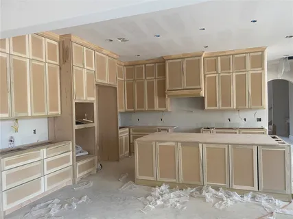 a kitchen with stainless steel appliances granite countertop a stove and a refrigerator