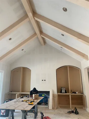 a workspace with furniture and mirror