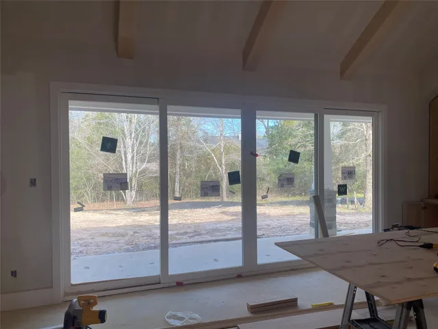 a view of a living room and floor to ceiling window