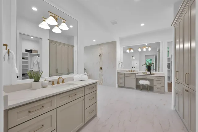a bathroom with a double vanity sink and a mirror