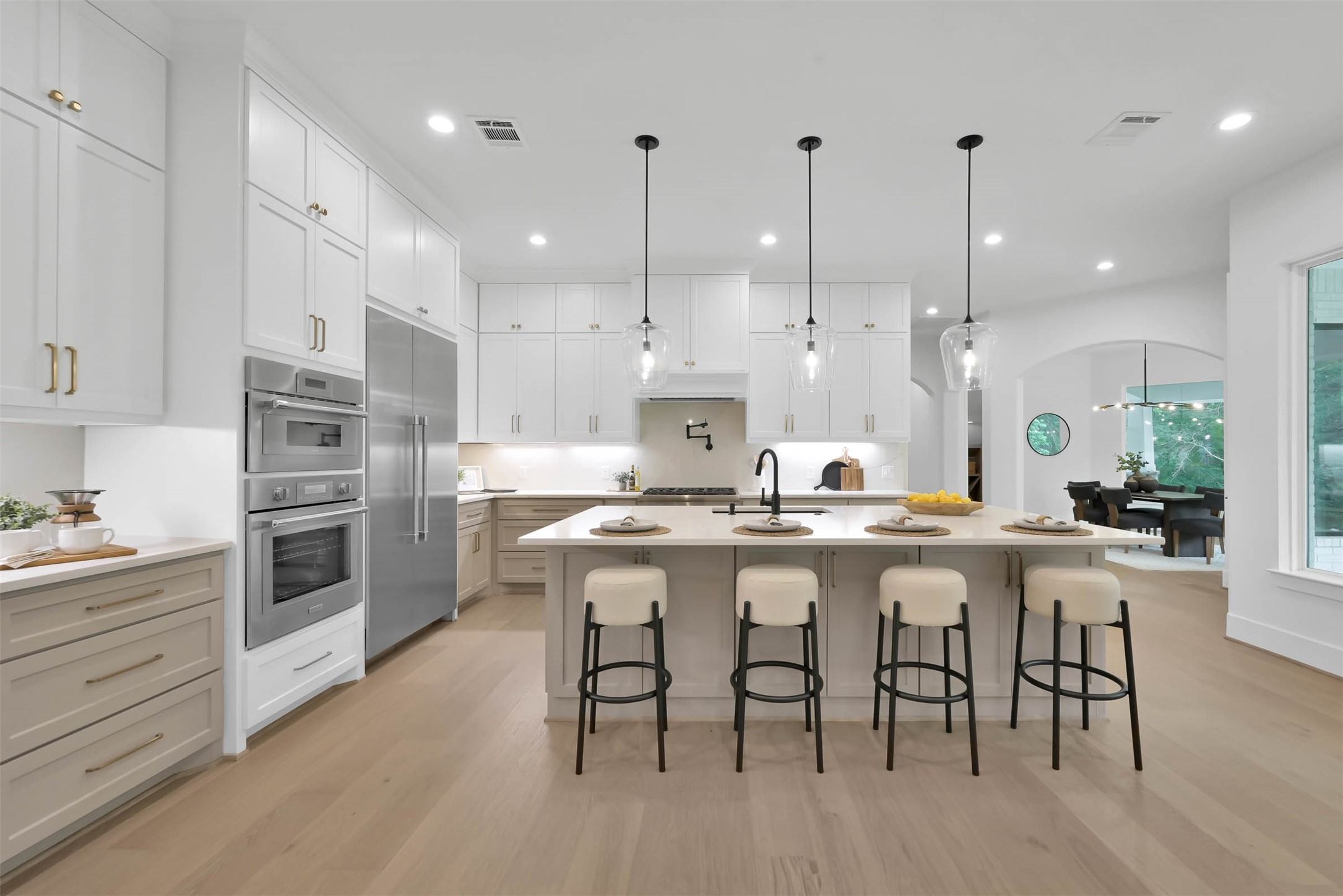 2437 Old Ranch Road Montgomery, TX 77316 - Photo 9 of 11 a kitchen with stainless steel appliances granite countertop a table chairs stove and cabinets