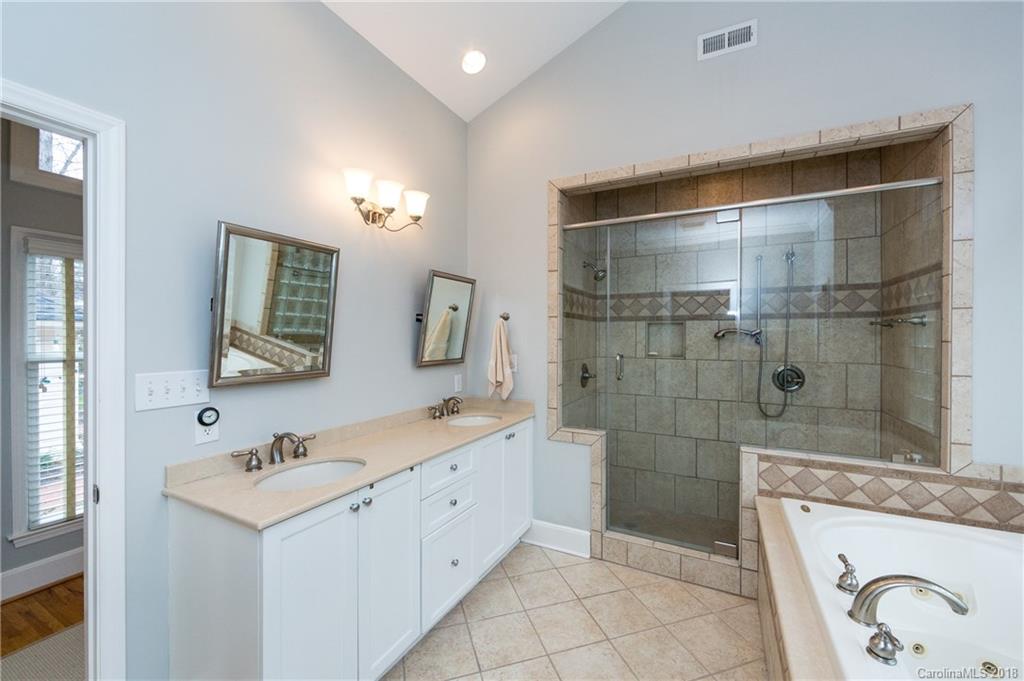 514 Ellsworth Road Charlotte, NC 28211 - Photo 22 of 36 a bathroom with a sink a toilet and shower