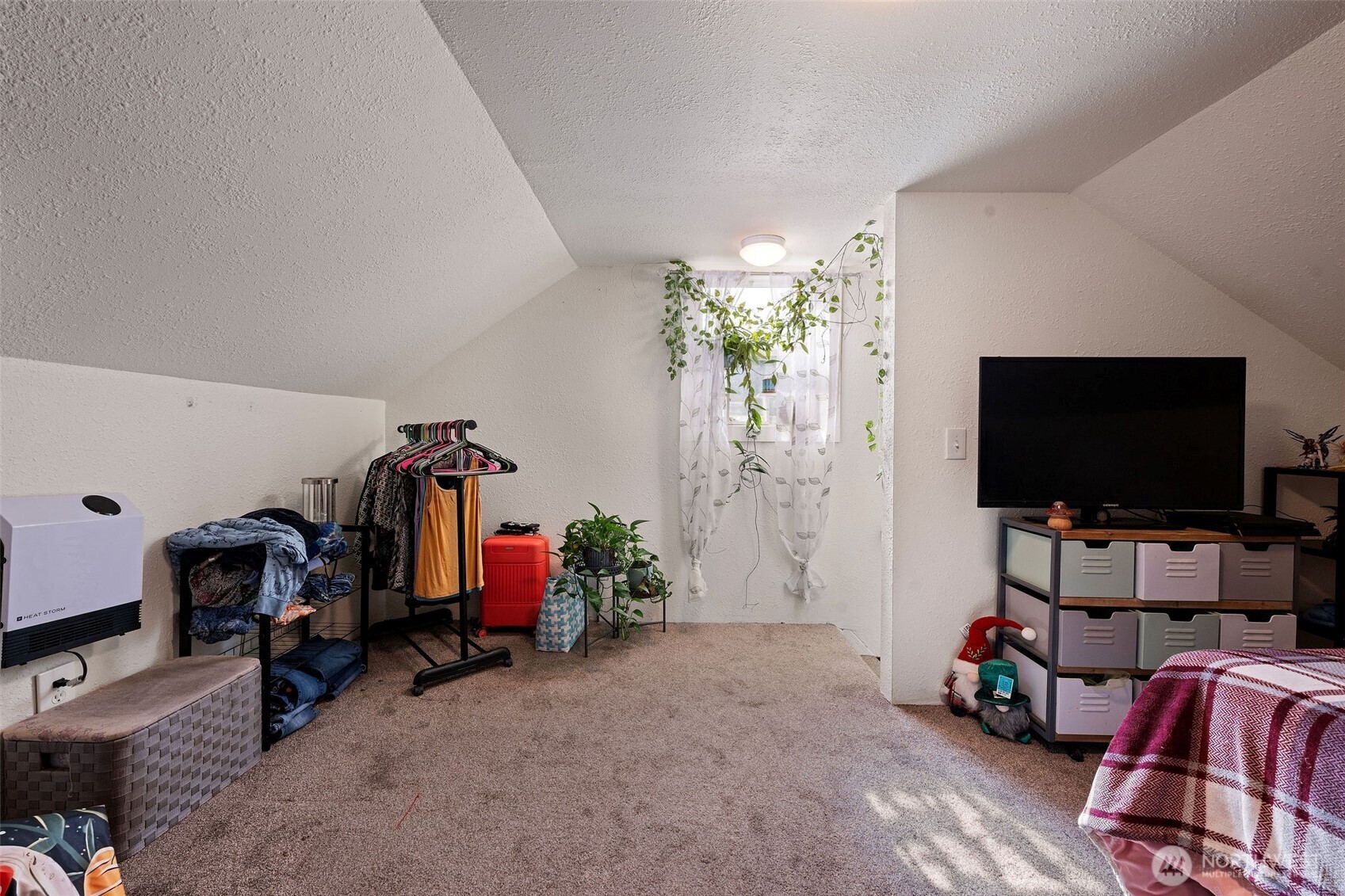1218 Cedar Street Raymond, WA 98577 - Photo 26 of 31 a living room with furniture and a flat screen tv