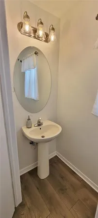 a bathroom with a sink and mirror
