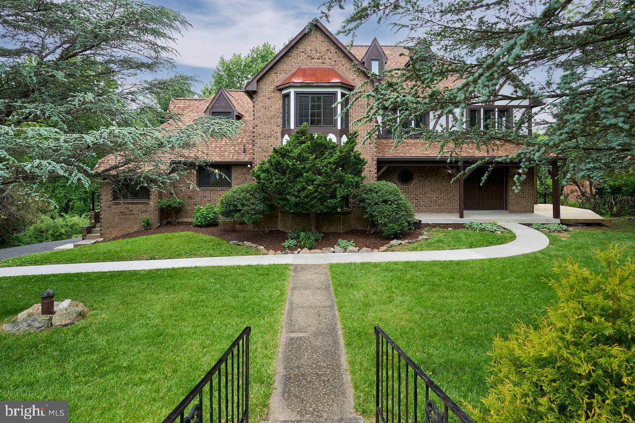 7423 Round Hill Road Frederick, MD 21702 - Photo 1 of 1 a front view of a house with garden