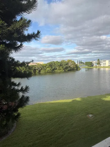 a view of a lake with houses in the back