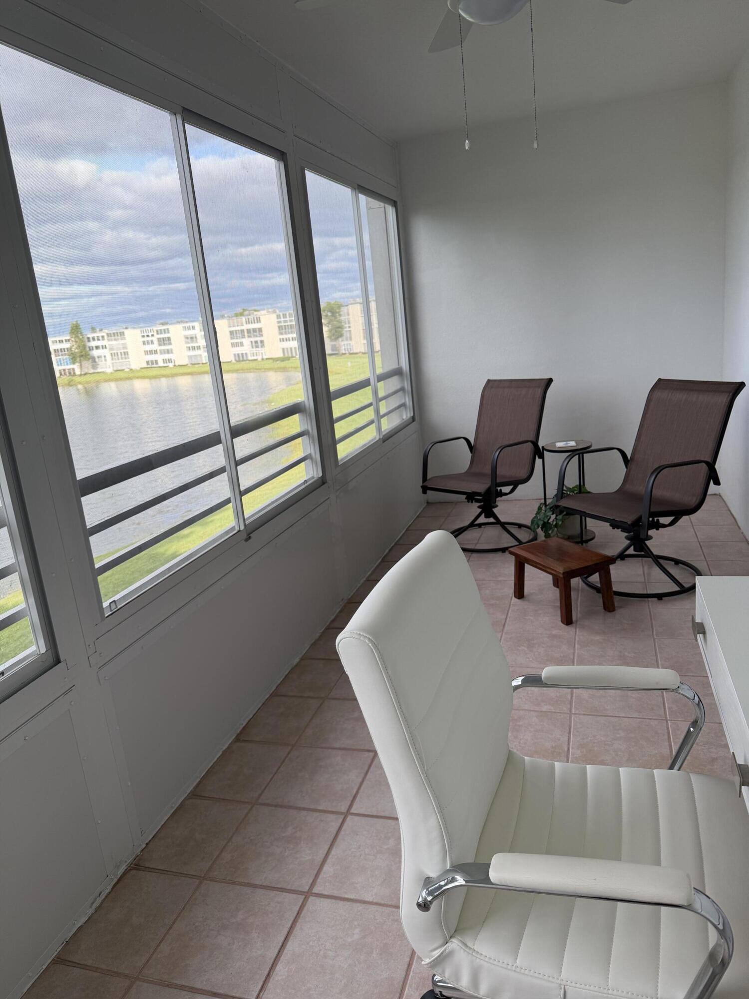 3062 Ainslie Drive Boca Raton, FL 33434 - Photo 17 of 27 a living room with furniture and a large window