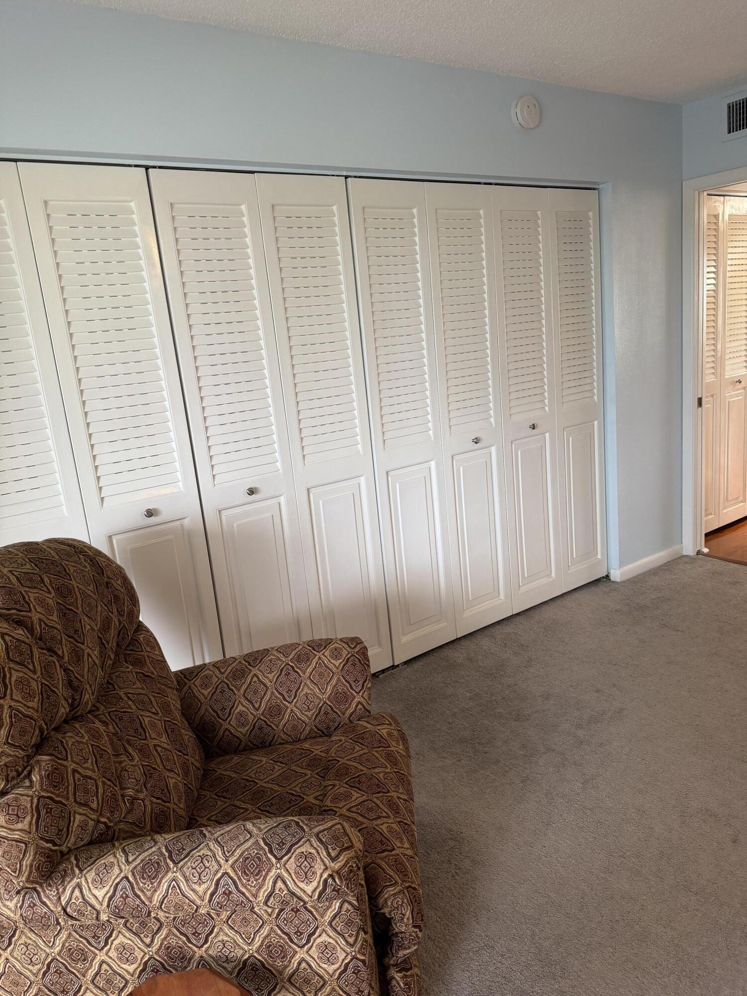 3062 Ainslie Drive Boca Raton, FL 33434 - Photo 20 of 27 a living room with a couch and a wooden floor