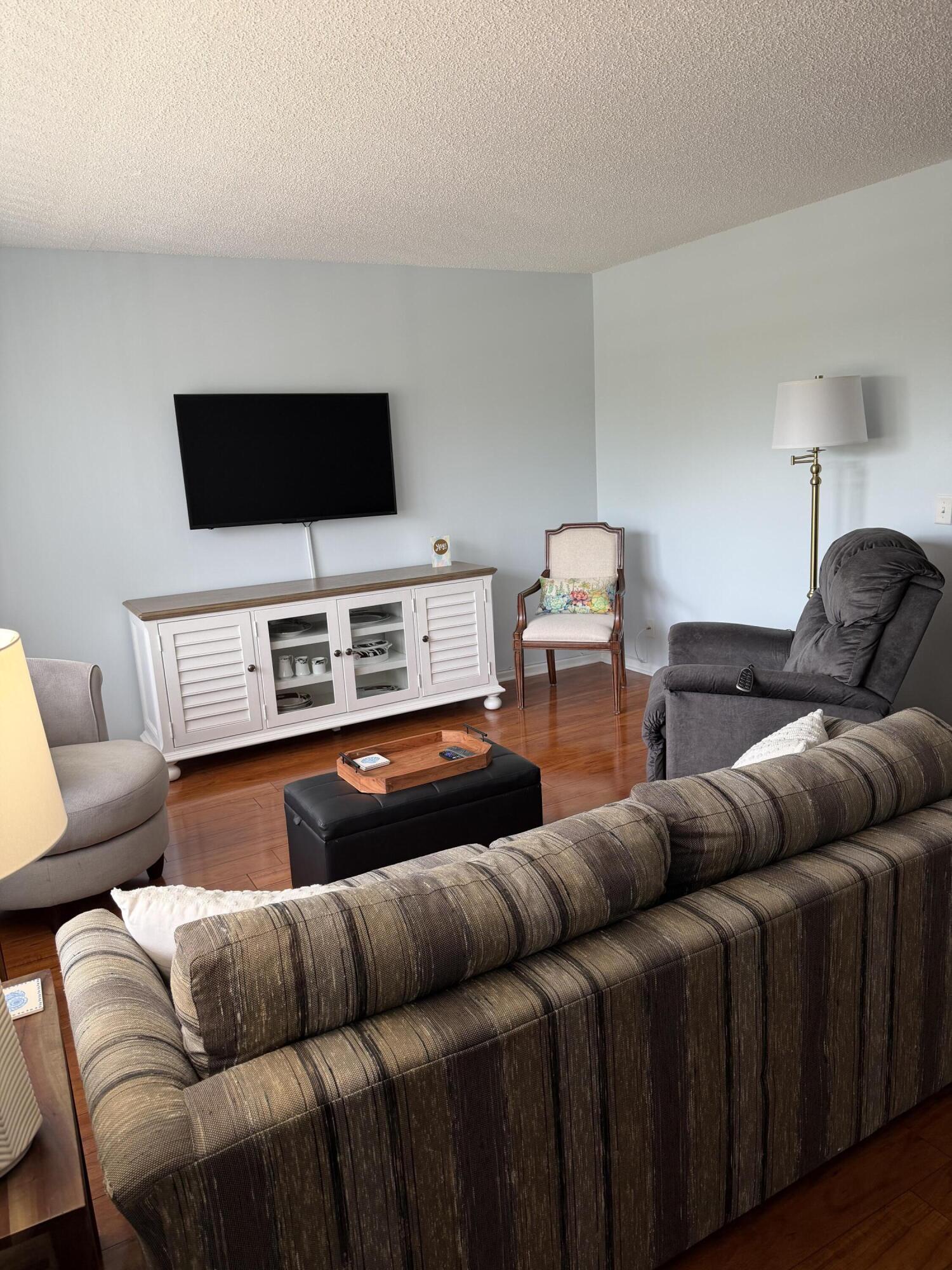 3062 Ainslie Drive Boca Raton, FL 33434 - Photo 2 of 27 a living room with furniture and a flat screen tv