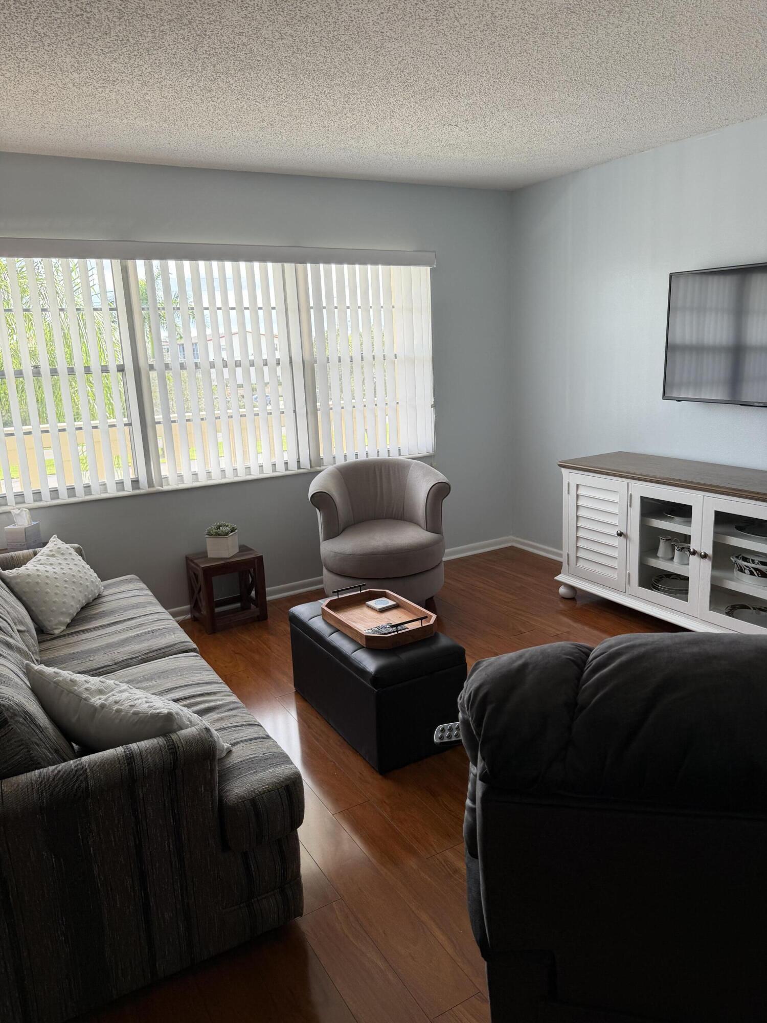 3062 Ainslie Drive Boca Raton, FL 33434 - Photo 6 of 27 a living room with furniture and a window