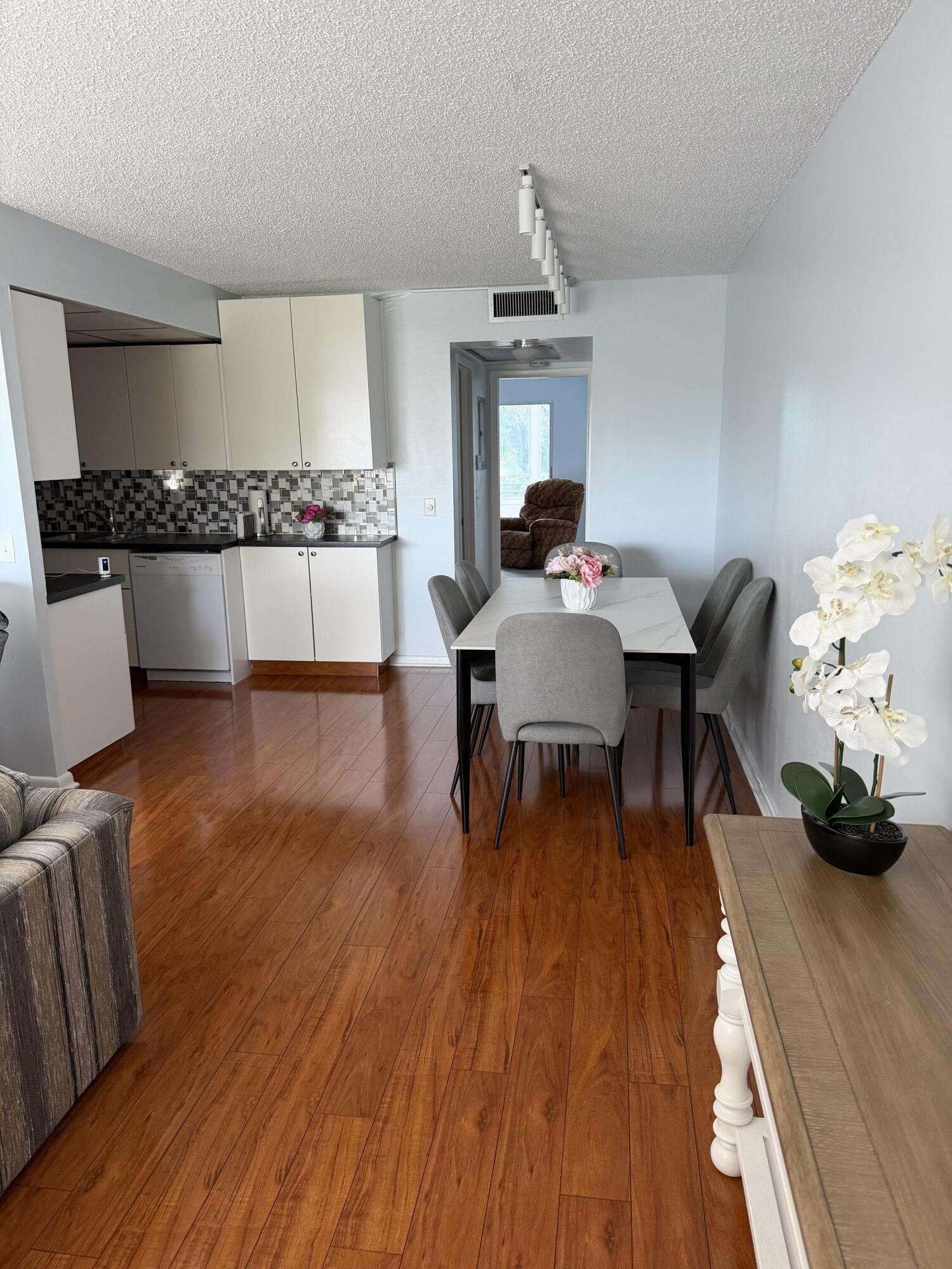 3062 Ainslie Drive Boca Raton, FL 33434 - Photo 9 of 27 a living room with furniture and a wooden floor