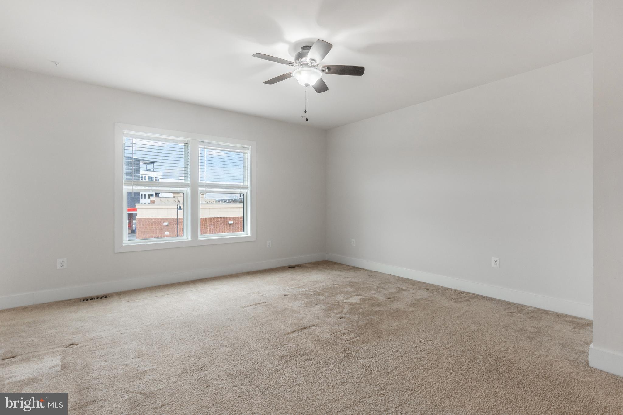 44730 Tiverton Square Ashburn, VA 20147 - Photo 15 of 39 an empty room with windows and ceiling fan