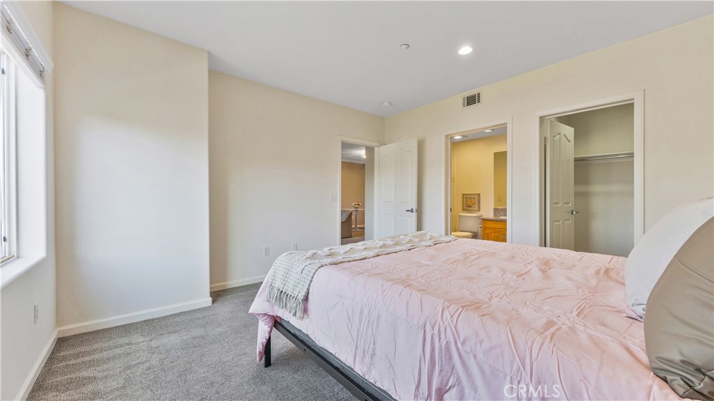 421 South Garfield Avenue, Unit 10 Monterey Park, CA 91754 - Photo 12 of 20 a bedroom with a bed and a window