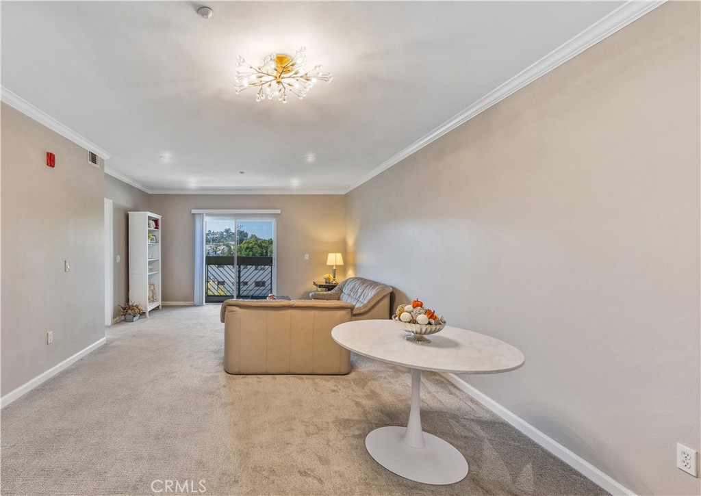 421 South Garfield Avenue, Unit 10 Monterey Park, CA 91754 - Photo 10 of 20 a living room with furniture and a table