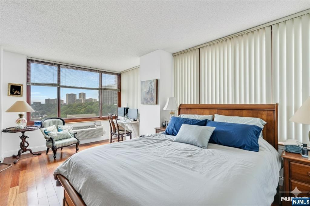 100 Old Palisade Road, Unit 1610 Fort Lee, NJ 07024 - Photo 7 of 21 a bedroom with a bed and large windows
