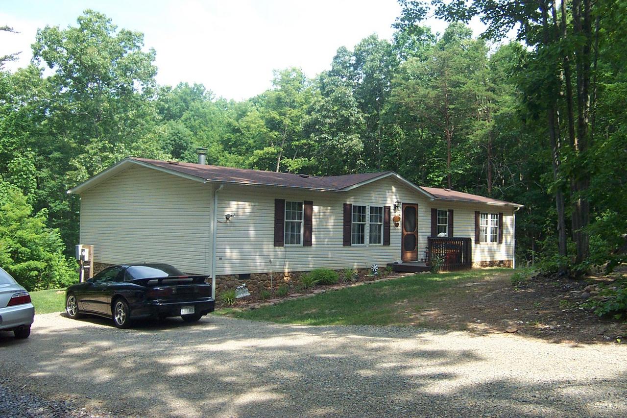2775 Sandy Level Road Goodview, VA 24095 - Photo 1 of 6 a house view with a garden space
