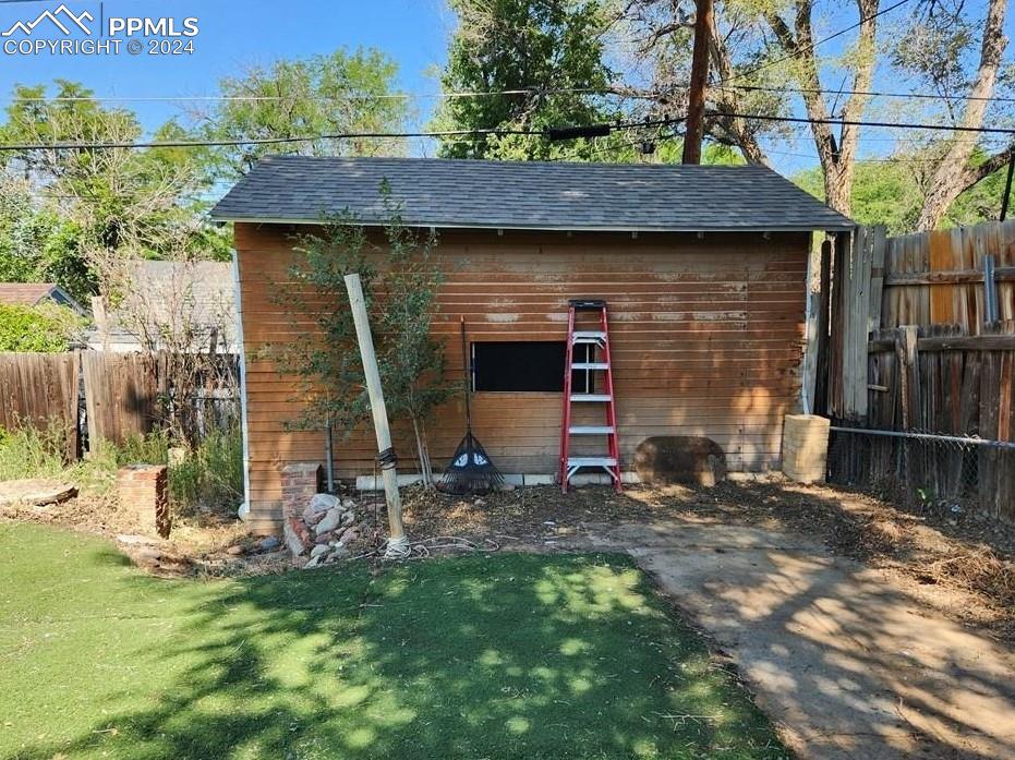 1509 Kickapoo Road Pueblo, CO 81001 - Photo 24 of 24 a front view of a house with a yard
