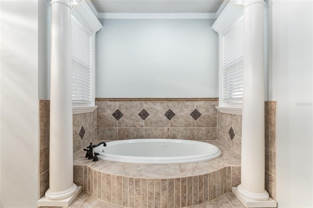 10614 Southwest 15th Lane Gainesville, FL 32607 - Photo 36 of 85 a bathroom with a bathtub and a toilet