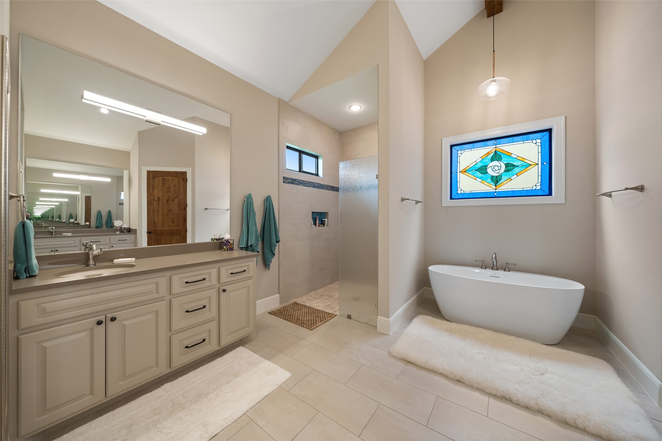 30163 High Spirit Ranch Road Hempstead, TX 77445 - Photo 24 of 49 a spacious bathroom with a mirror a bathtub and a sink