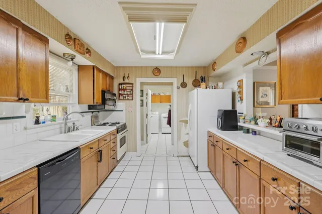 a large kitchen with a large window