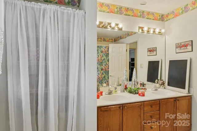 a bathroom with a double vanity sink and a mirror