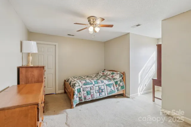 a bedroom with bed and window