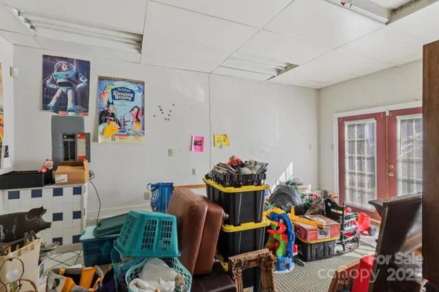 a living room with lots of furniture and a white walls