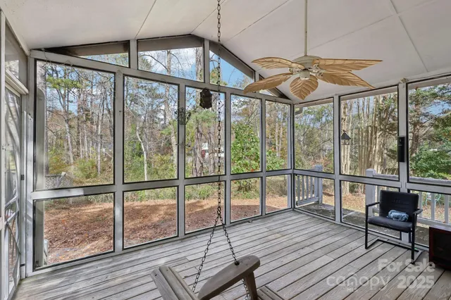 a view of a balcony with furniture