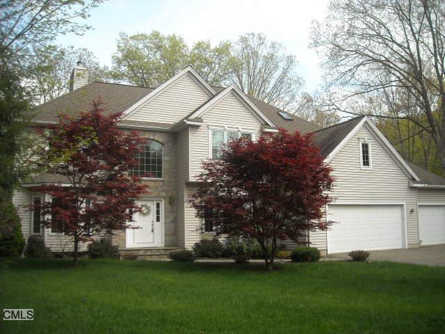 7 Valley Field Road North Newtown, CT 06482 - Photo 1 of 1 a view of a white house next to a yard with big trees