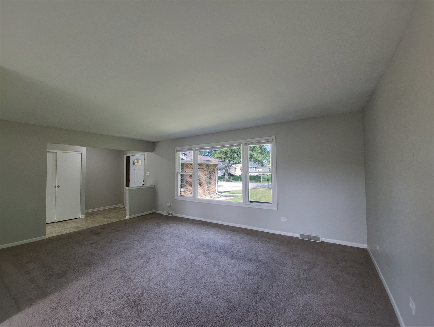 6037 Spring Lane Matteson, IL 60443 - Photo 3 of 29 an empty room with windows