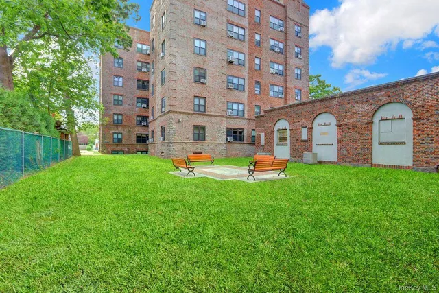 a front view of building with garden