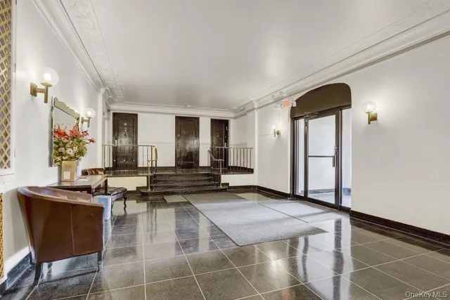 a lobby with furniture and window