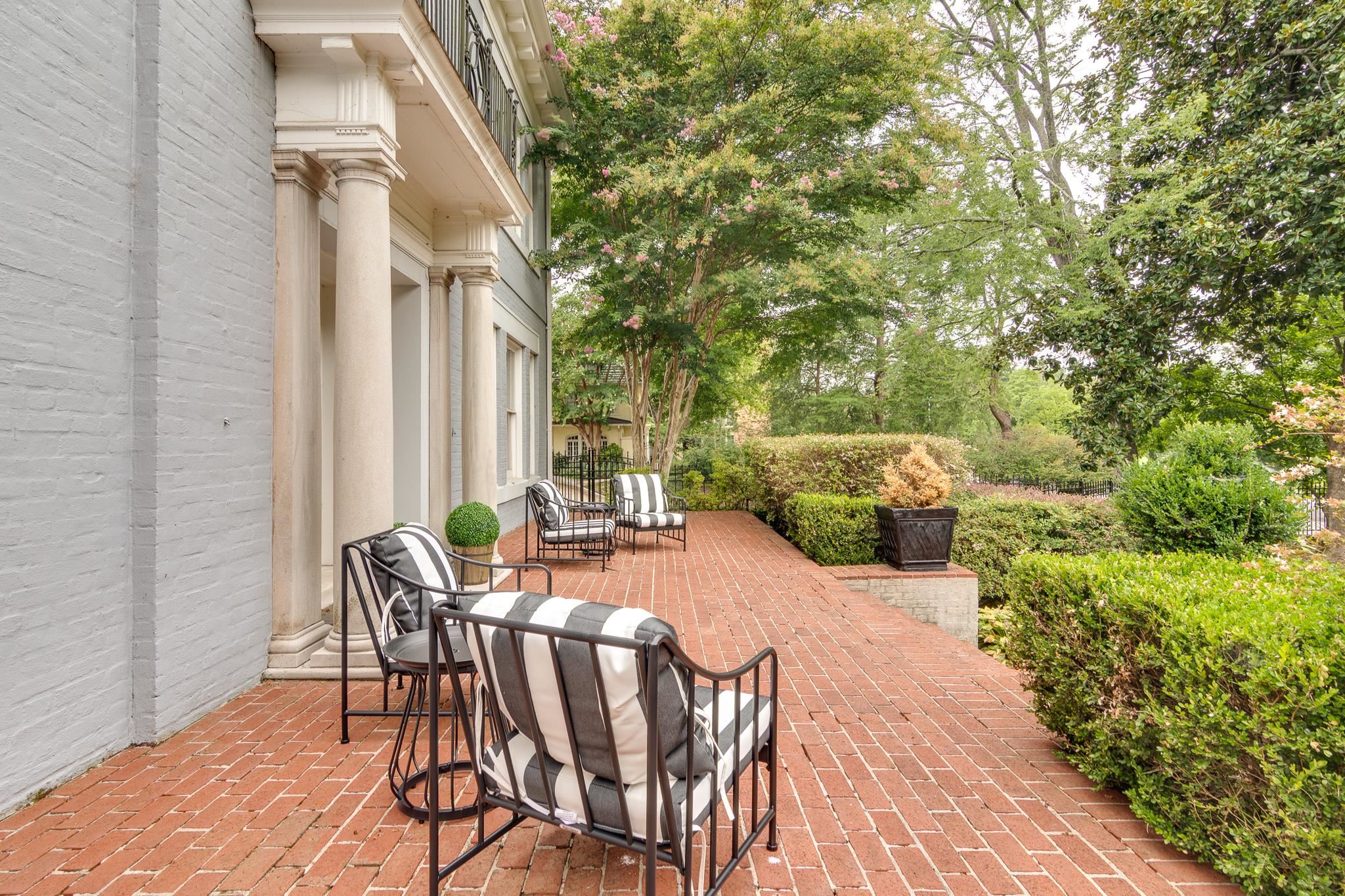 2221 Poplar Avenue Memphis, TN 38104 - Photo 2 of 40 a patio with table and chairs and potted plants