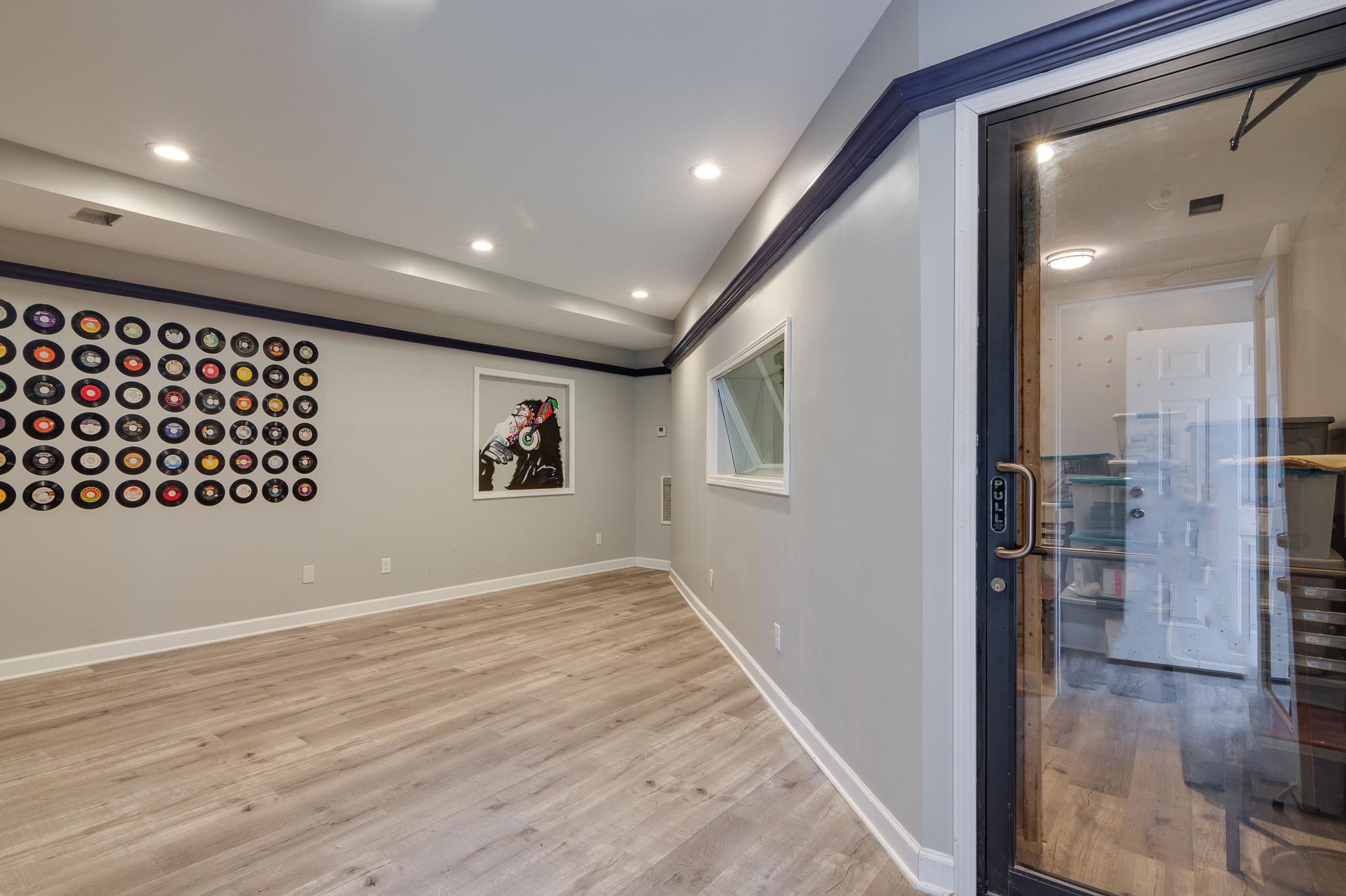 2221 Poplar Avenue Memphis, TN 38104 - Photo 36 of 40 wooden floor with a bench in a room