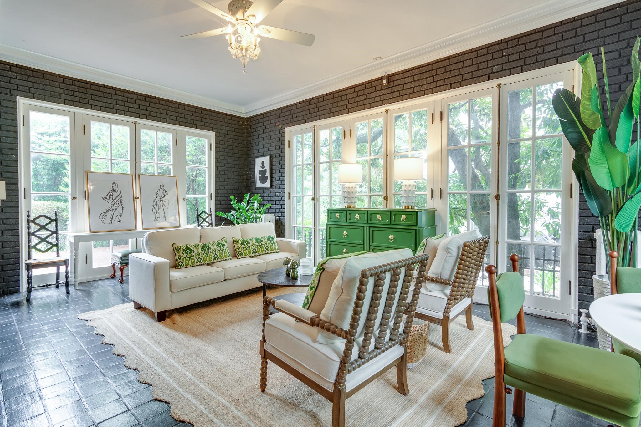 2221 Poplar Avenue Memphis, TN 38104 - Photo 7 of 40 a living room with furniture and a large window with garden view