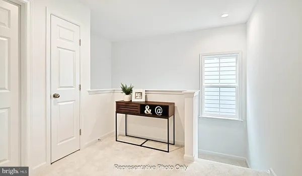 a view of an entryway and livingroom