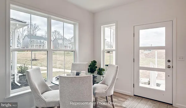 a dining room with furniture window wooden floor