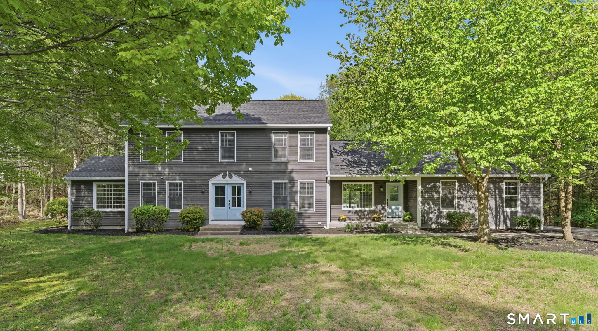 21 Greenwood Road North Granby, CT 06060 - Photo 1 of 40 a front view of a house with garden
