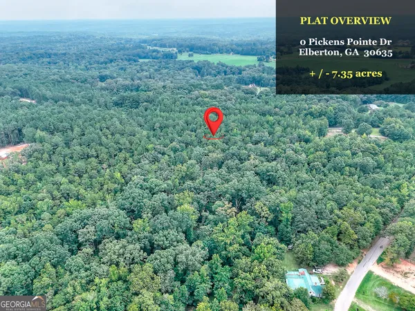 a view of outdoor space with signage and flags