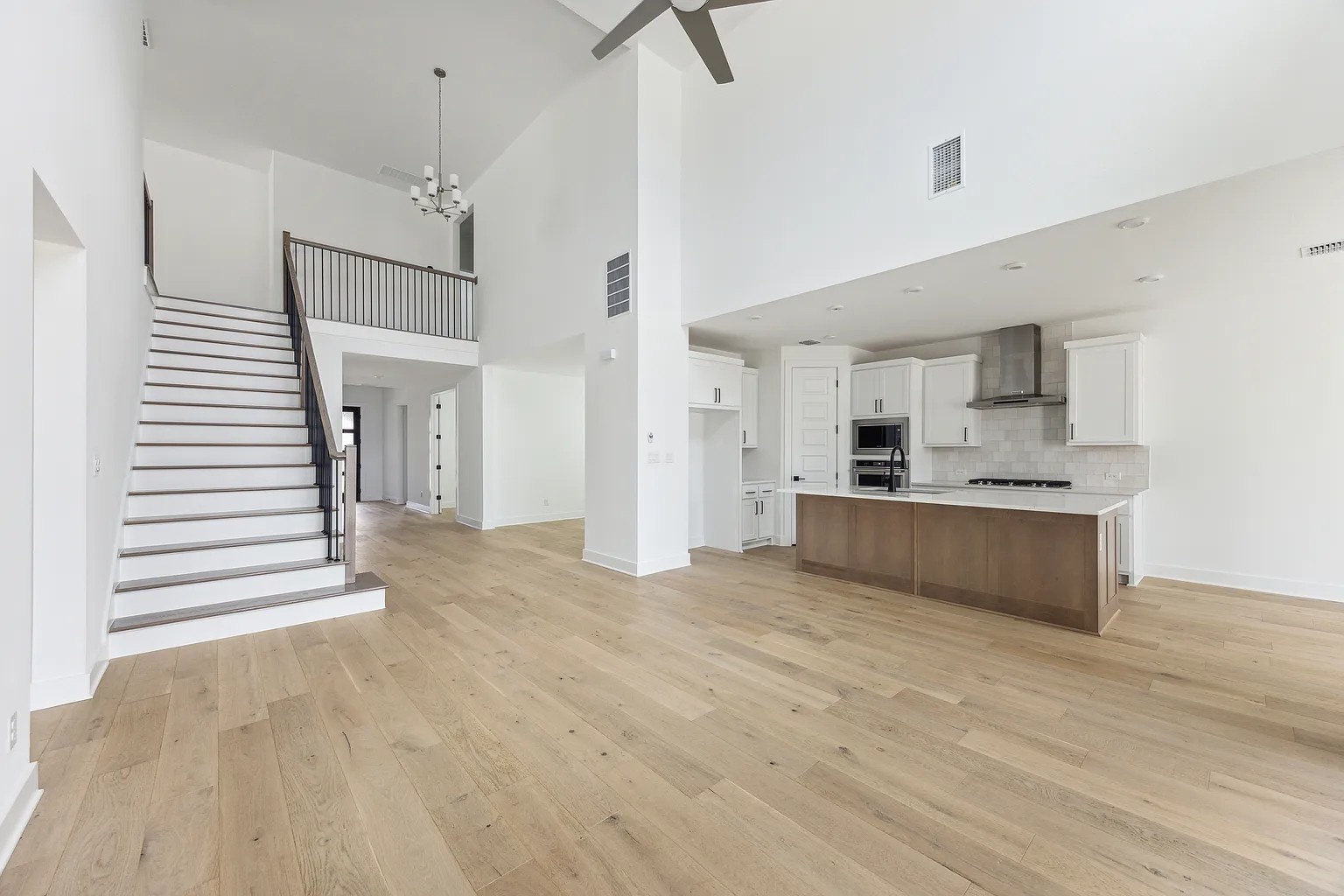 1909 Varese Path Leander, TX 78641 - Photo 11 of 40 A spacious, airy interior offers soaring ceilings and an open-concept design with sleek finishes.