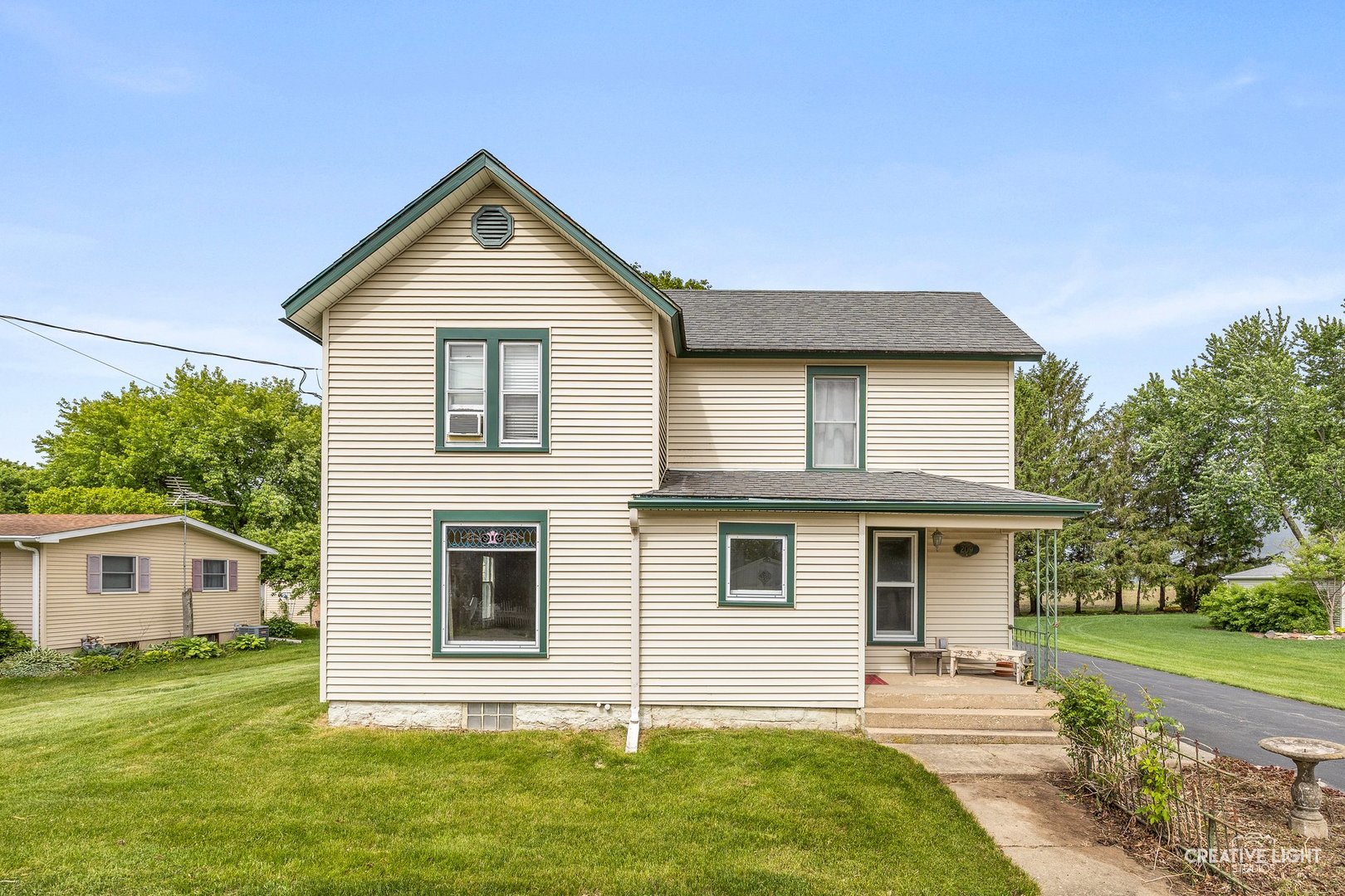 209 North Shabbona Road Shabbona, IL 60550 - Photo 1 of 25 a front view of a house with a yard