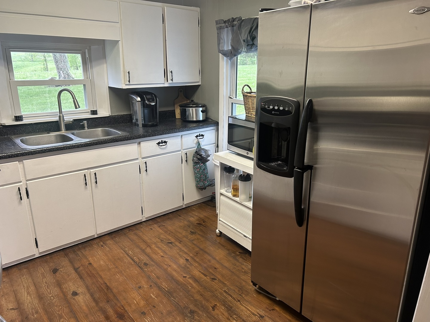 1 Bushwack Road Golconda, IL 62938 - Photo 20 of 38 a kitchen with stainless steel appliances kitchen island granite countertop a sink a stove a counter space and cabinets